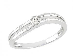 Diamond with two round-cut diamonds on either side set in a 10-karat white-gold band.jpg